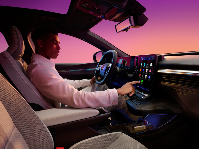 Man inside Renault scenic pressing button on screen on dashboard with purple pink graduated background